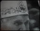 Pope’s mitre has Baal sun symbol